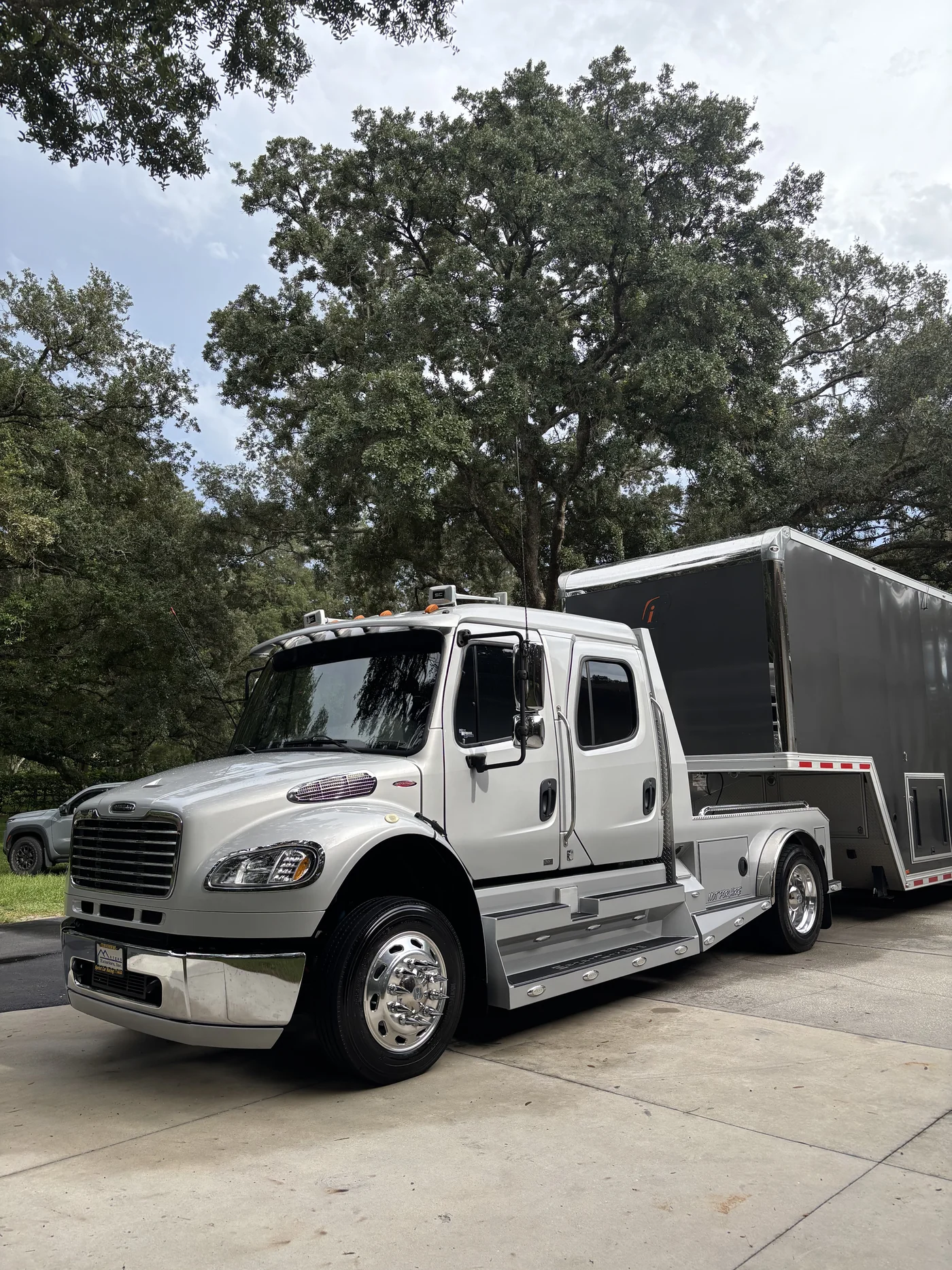 Silver Freightliner hauler and enclosed trailer detailed and finished