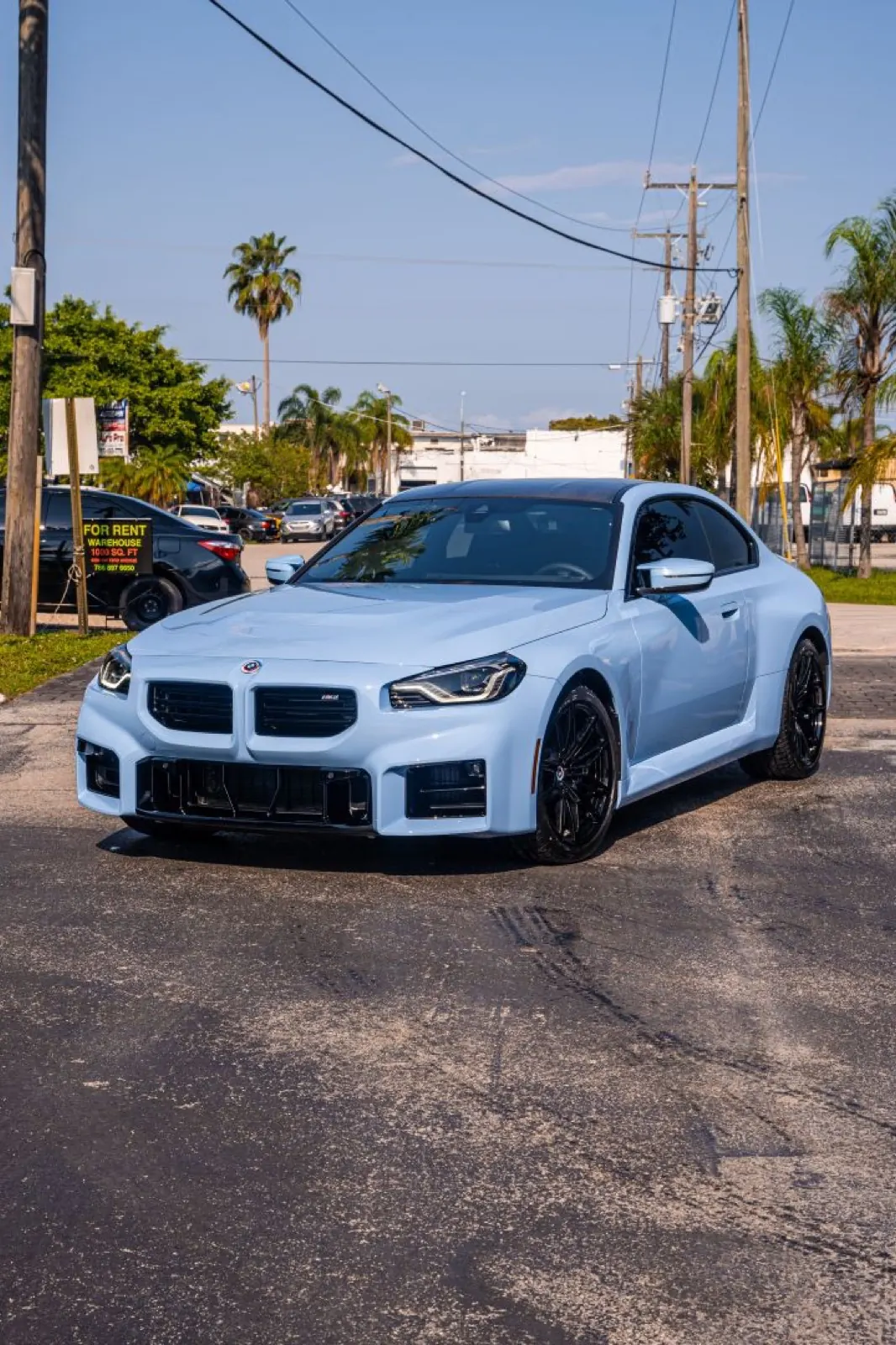 Blue BMW G87 M2 in the detailing studio