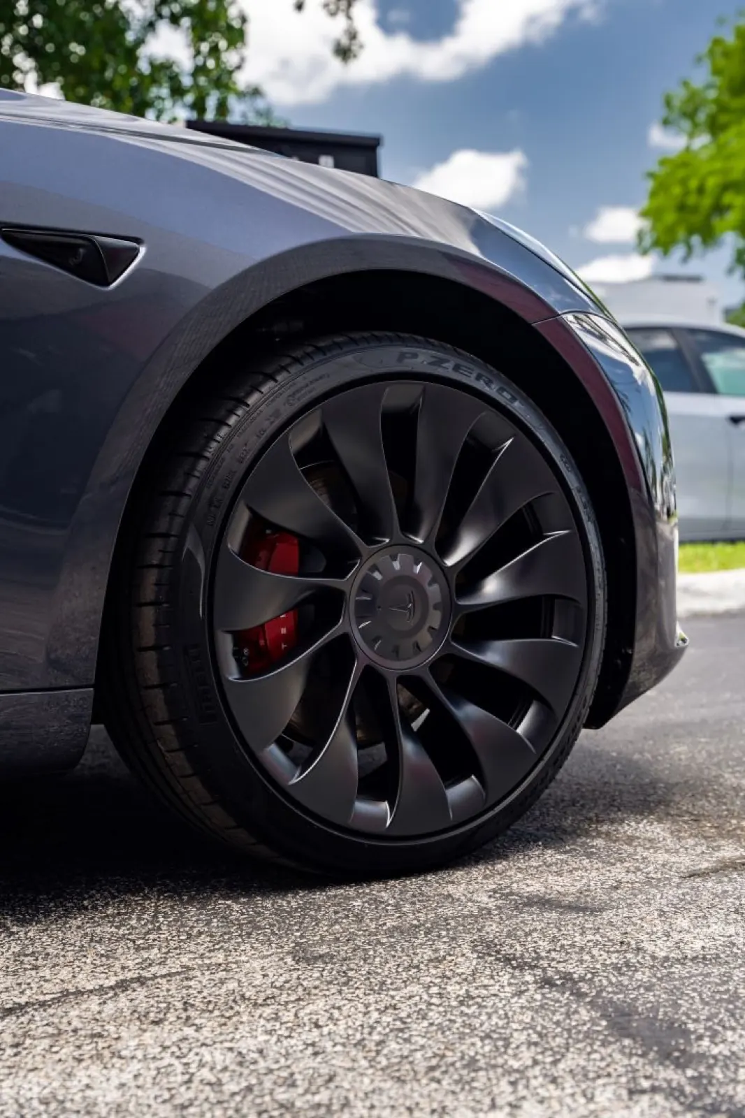 Tesla wheel with red performance brake caliper